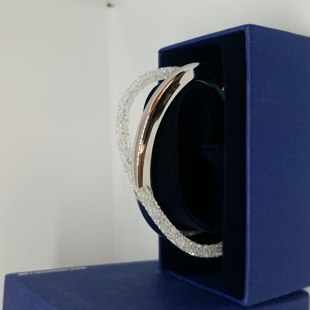Swarovski Crystaldust cross cuff bracelet never worn in box.